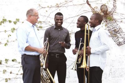 Lusaka Brass Group in front of a wall